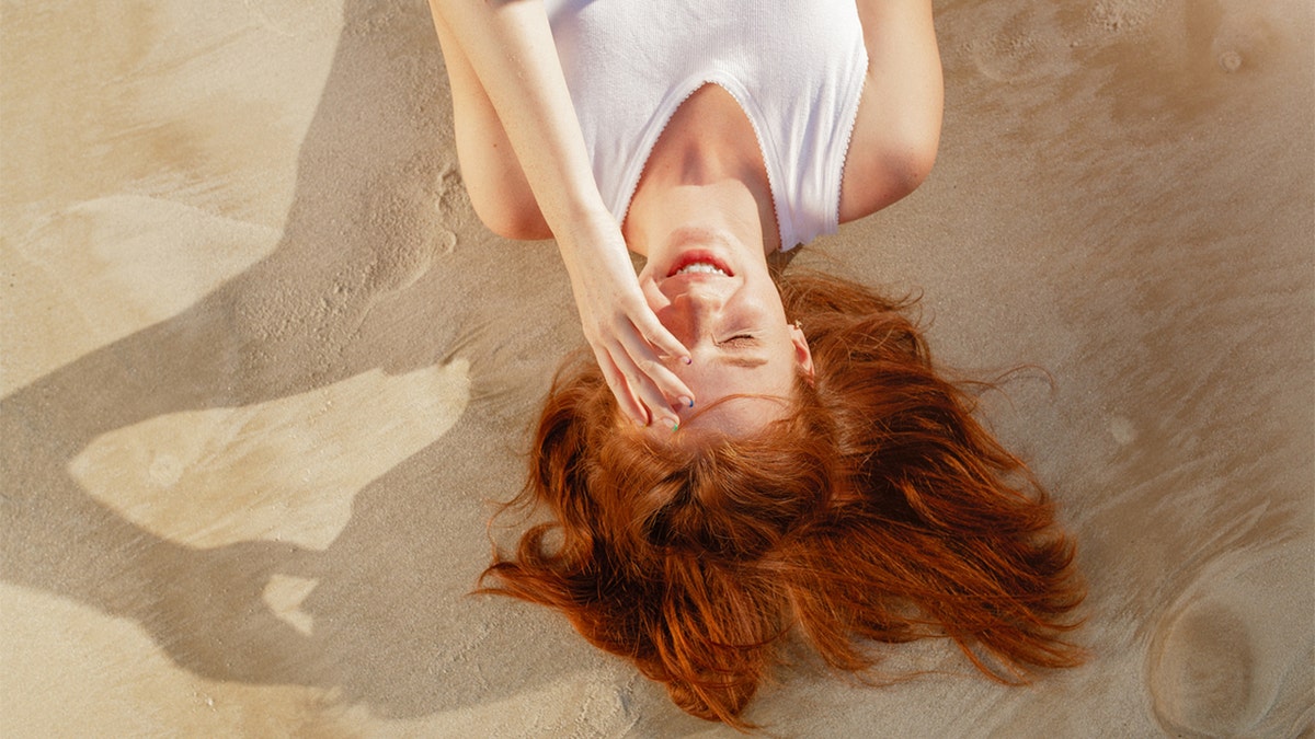 redhead on the beach