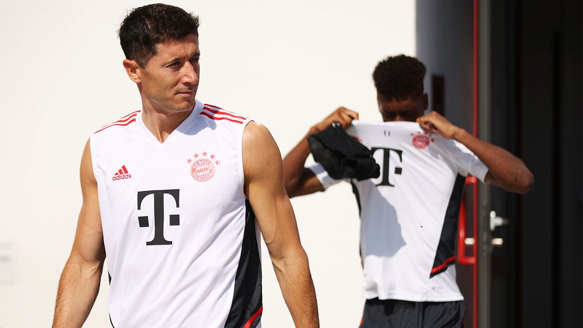 Robert Lewandowski walks onto the training pitch