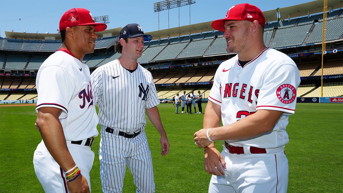 Juan Soto, Gerrit Cole, and Mike Trout having a conversation