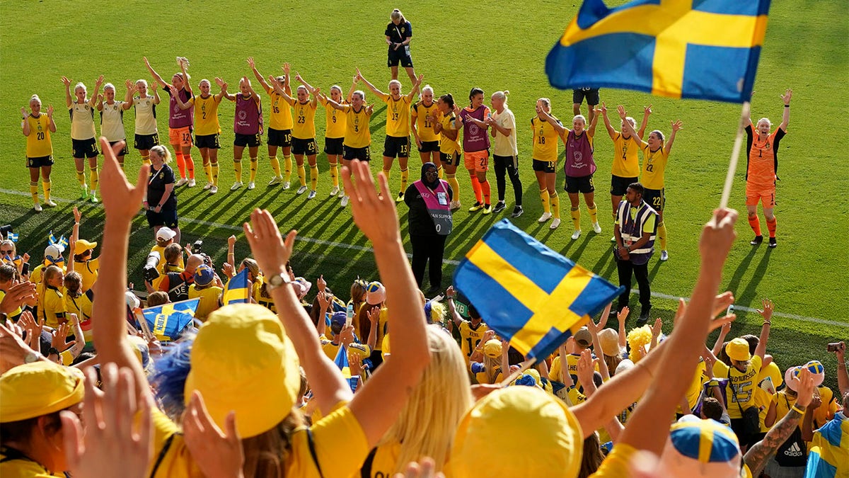 Sweden celebrates with fans after victory