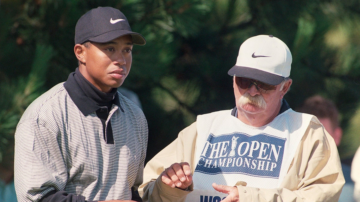 Tiger Woods with his caddie in 1998