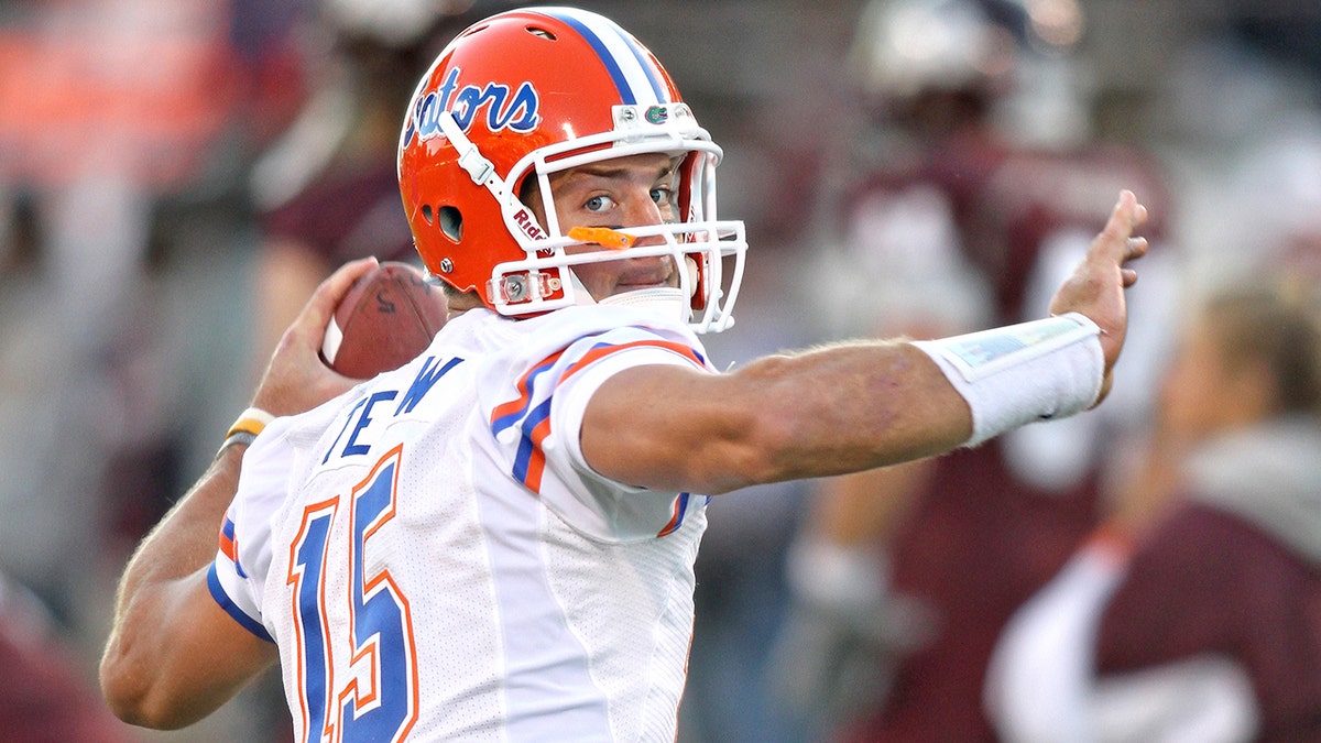 Tim Tebow throws a pass