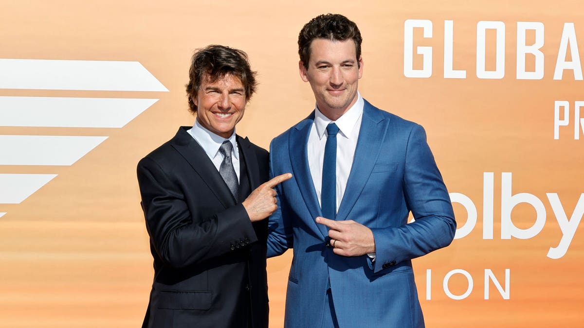 Tom Cruise and Miles Teller on the red carpet