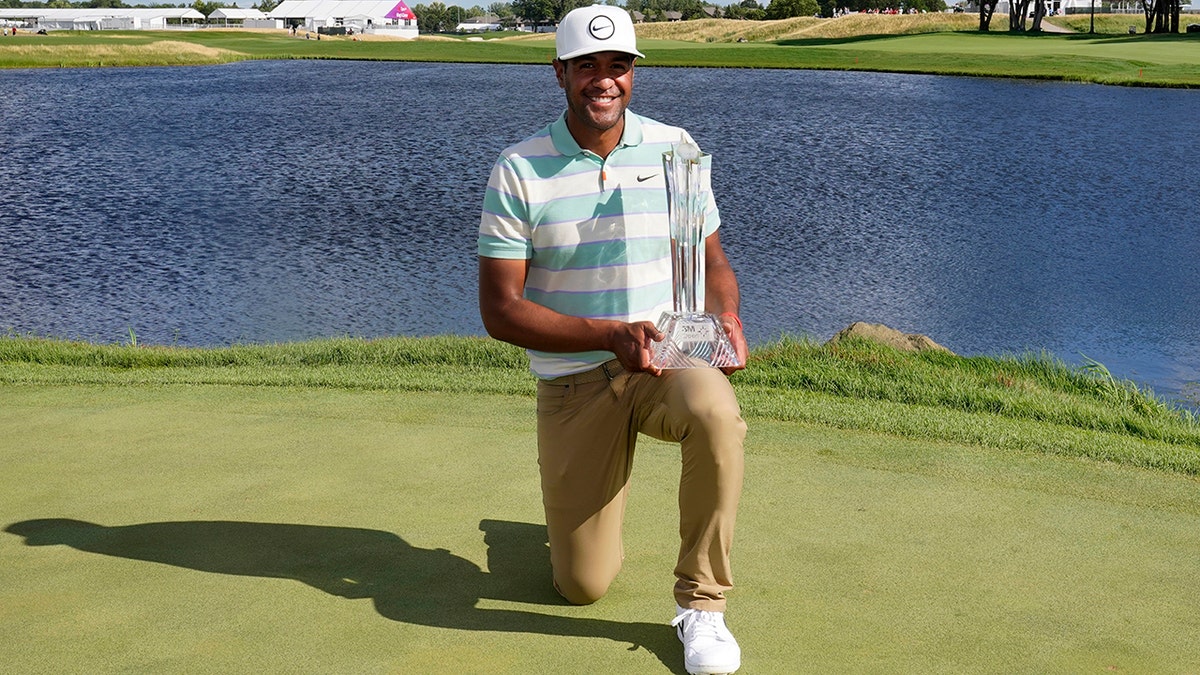 Tony Finau poses with the 3M Open trophy