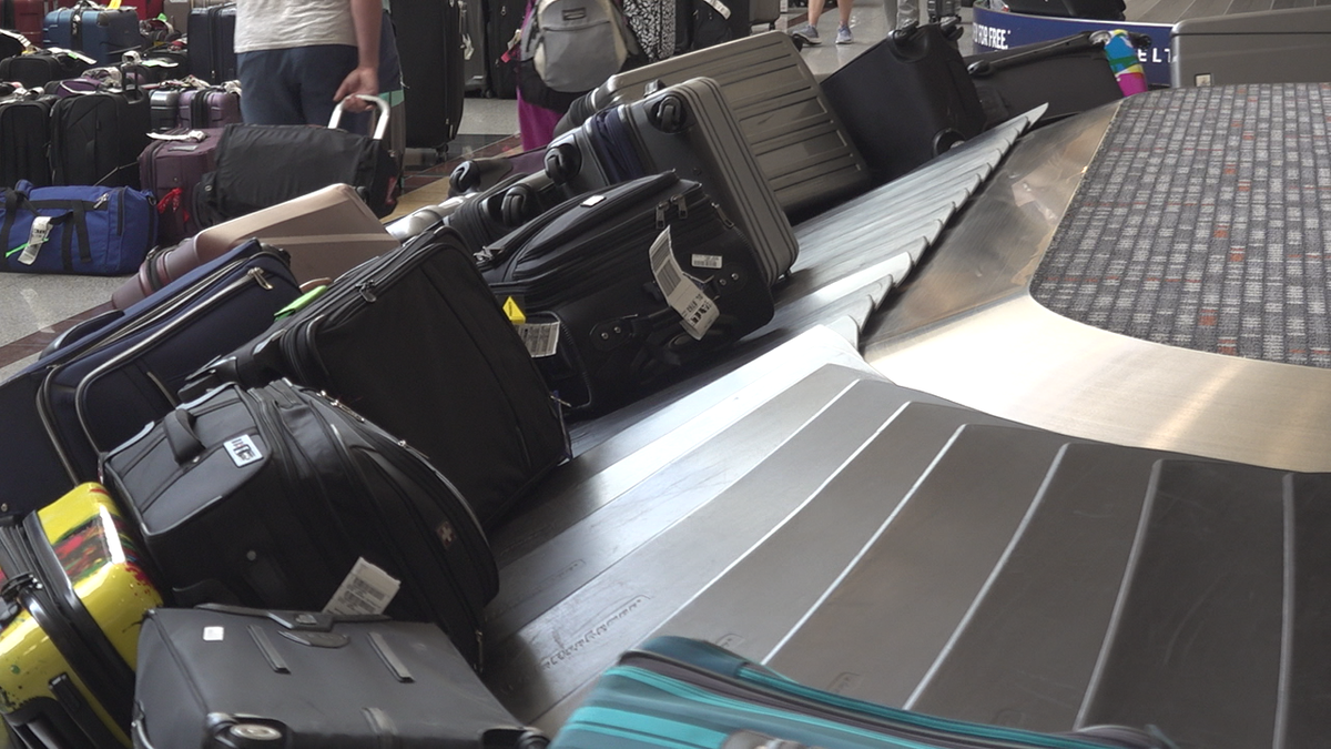 Airport baggage claim with suitcases