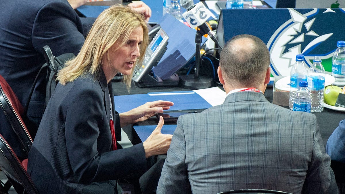 Cammi Granato talks to member of the draft table