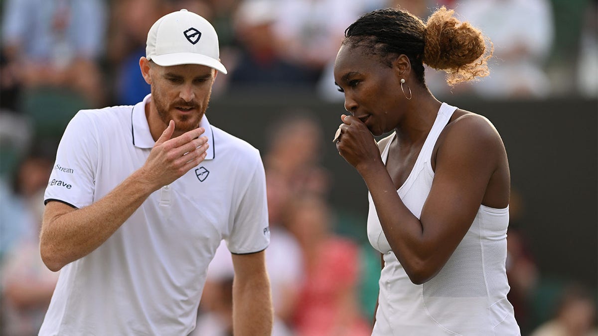 Venus Williams and Jamie Murray interact