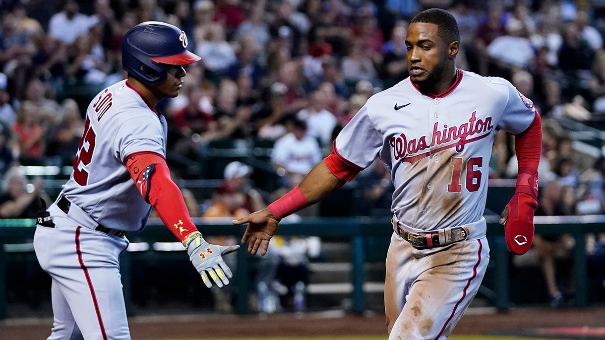 Victor Robles scores a run