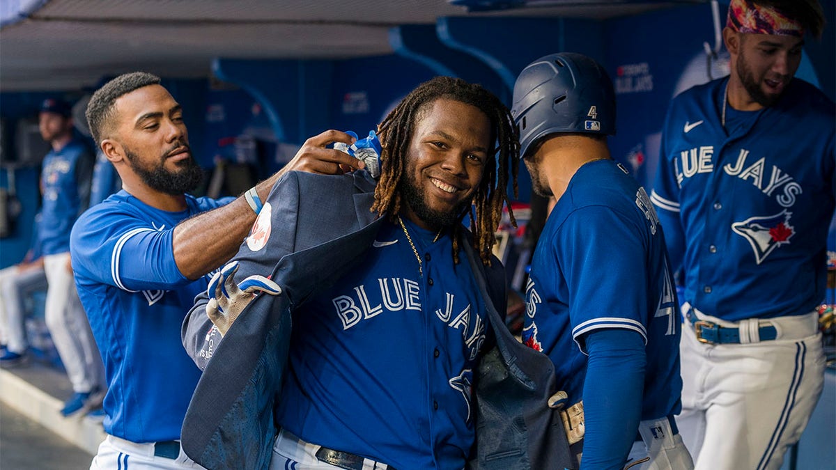 Vladimir Guerrero Jr. celebrates with the home run jacket