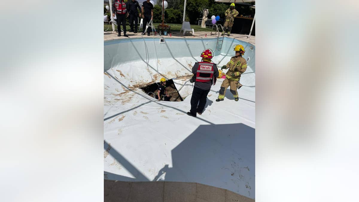 Sinkhole opens in pool