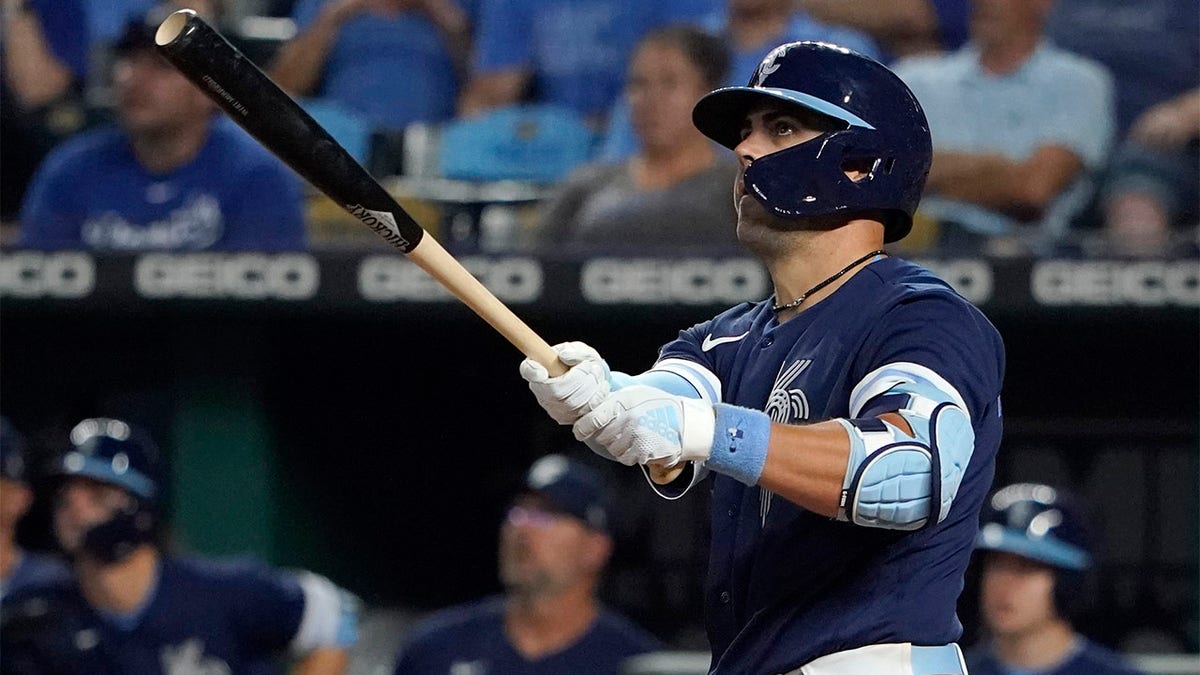Whit Merrifield makes contact with the ball