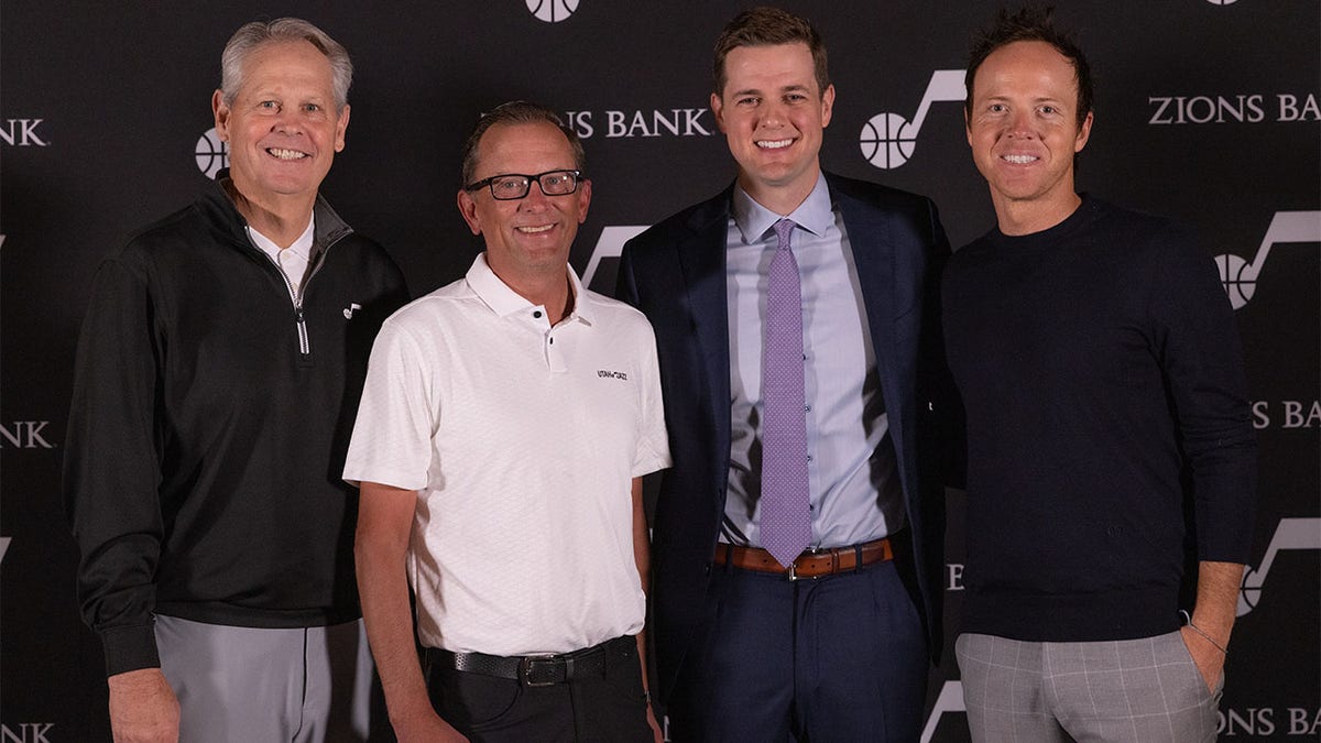 Danny Ainge, Ryan Smith, Will Hardy, and Justin Zanik pose for a photo