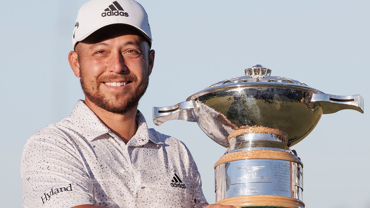 Xander Schauffele holds up Scottish Open trophy