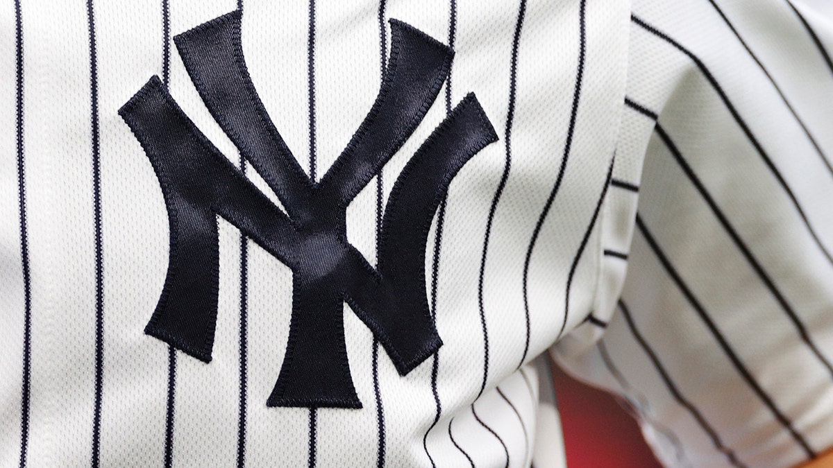 A Yankees logo on the Pinstripe uniforms