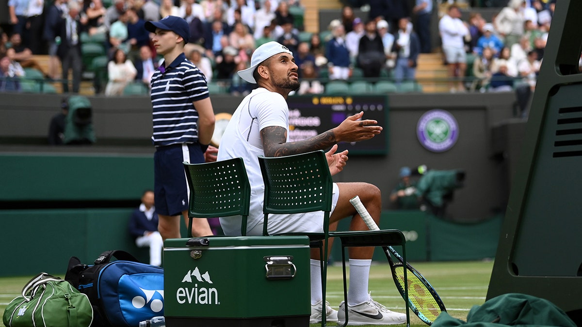 Nick Kyrgios speaks with the umpire