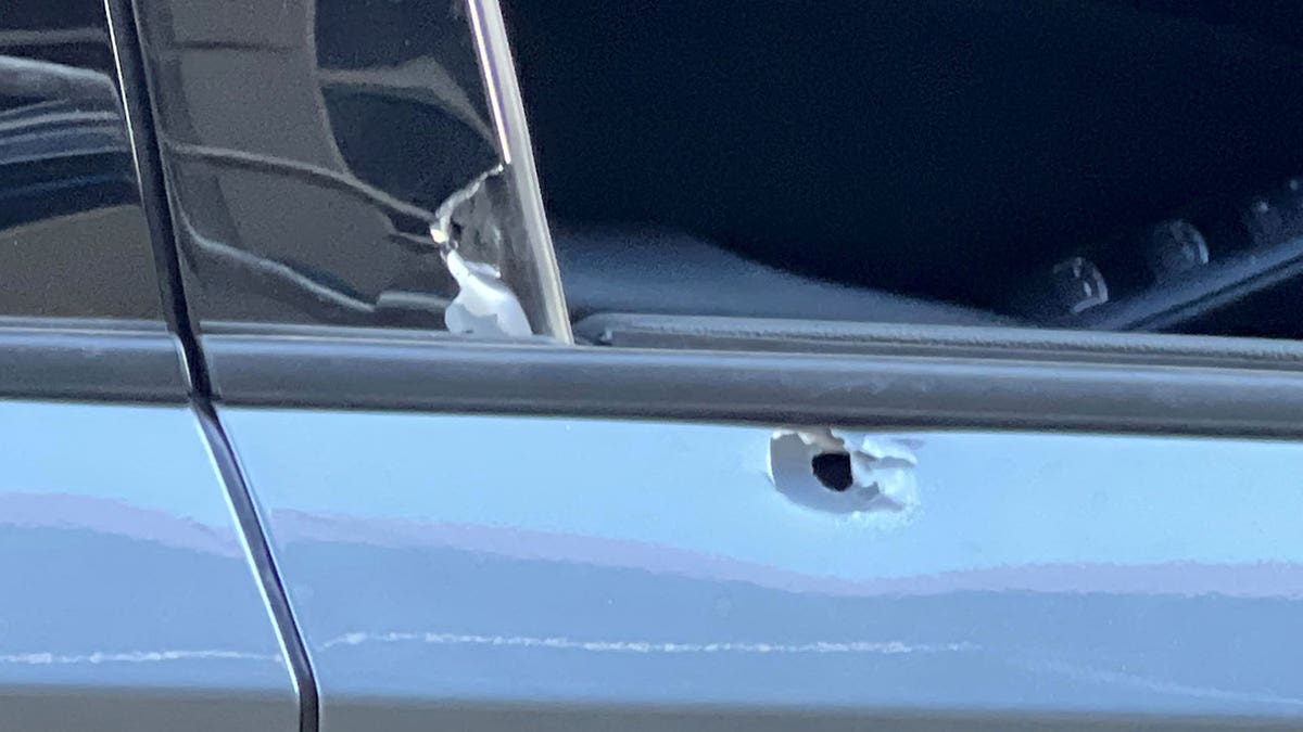 Victim car with bullet hole