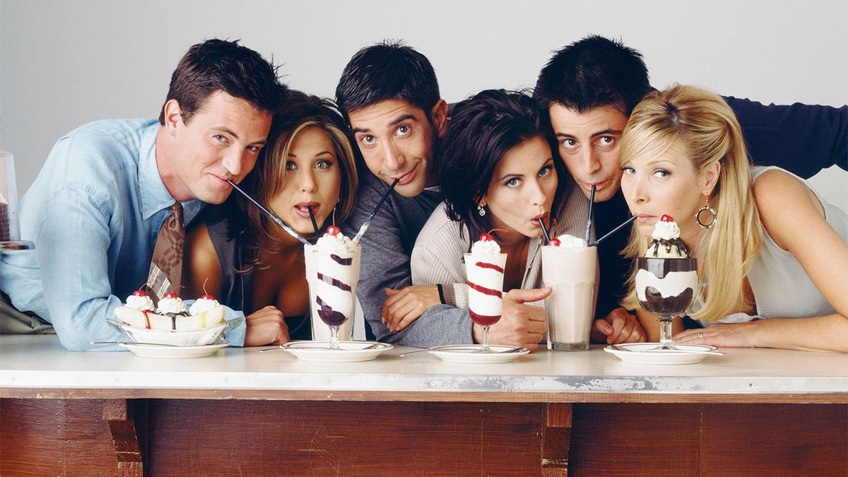 Cast of "Friends" drinking milkshakes.