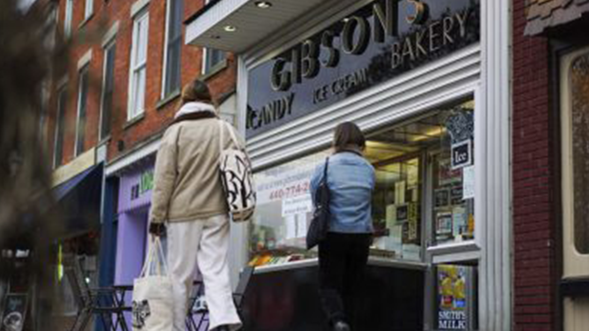 People walking near storefront of Gibson's Bakery in Oberlin, Ohio