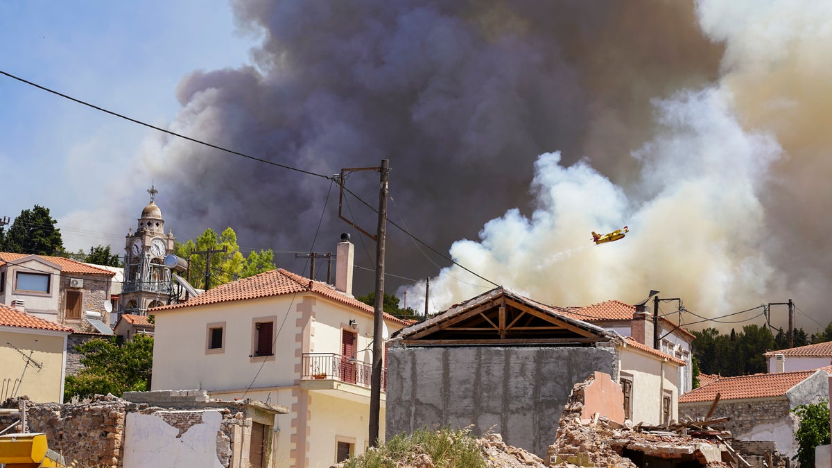Firefighters combat flames on the island of Lesbos
