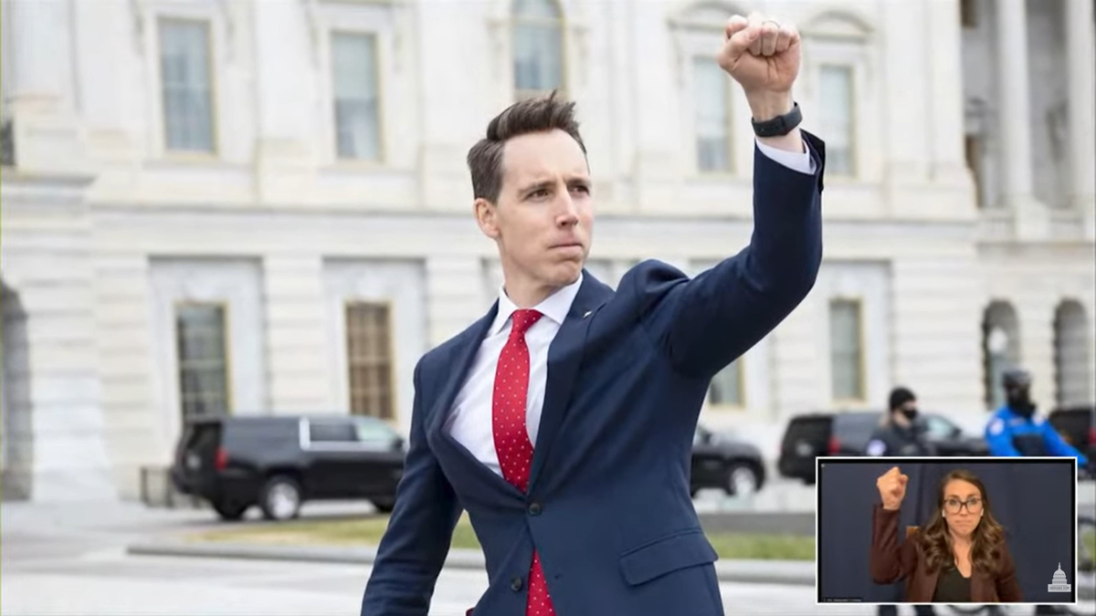 Josh Hawley raises fist to protesters