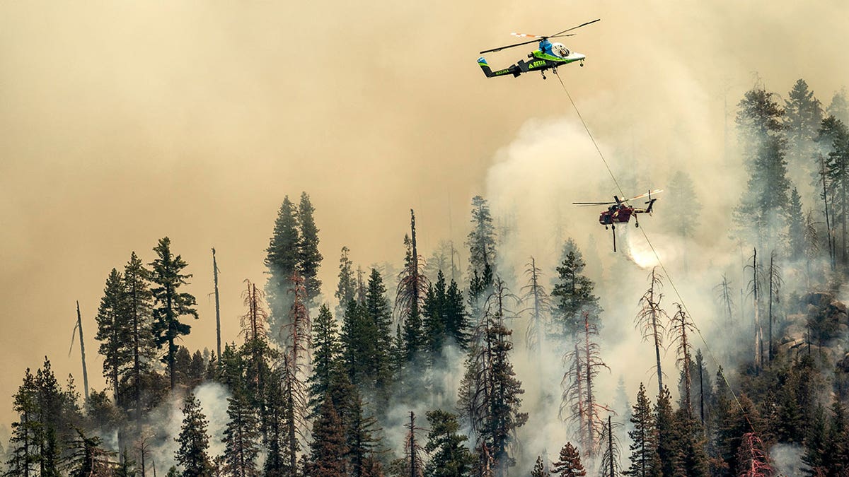 Helicopter flies over Yosemite during fires