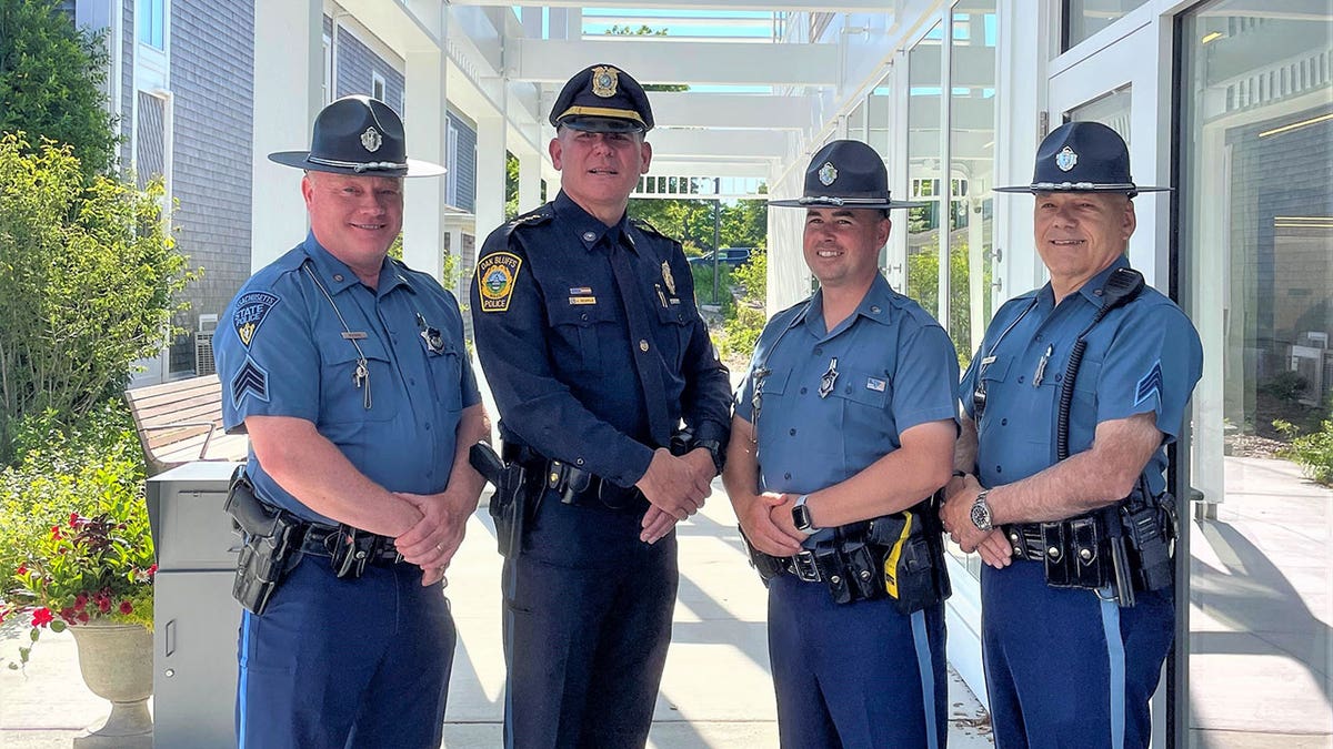 Jonathan Searle and state police in uniform at swearing-in ceremony