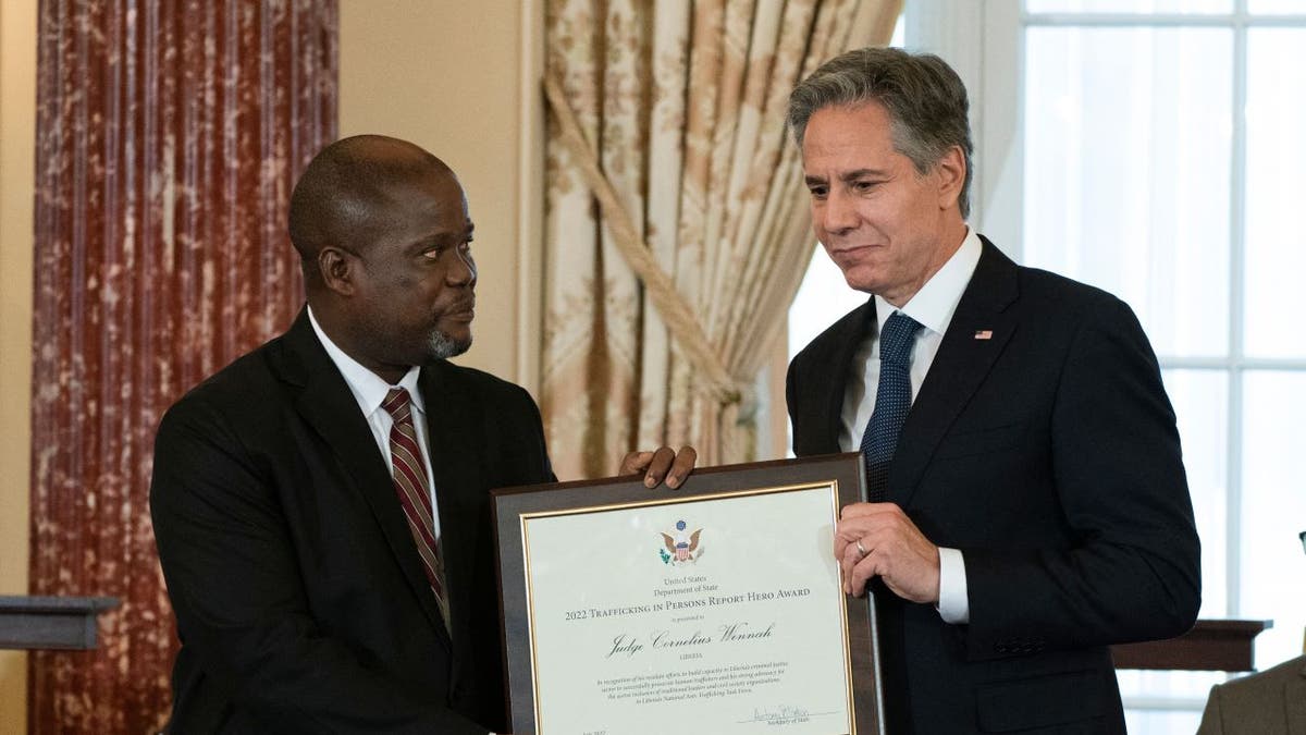 US Secretary of State Antony Blinken presents award to Liberian man