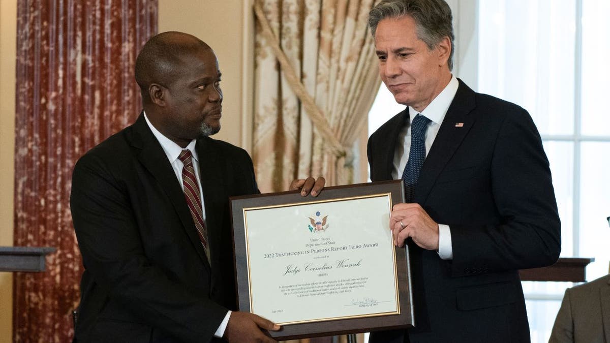 US Secretary of State Antony Blinken presents award to Liberian man