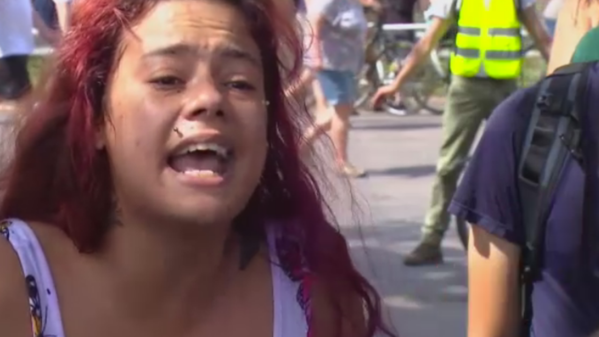 Arabella Foss-Yarbrough confronts protestors outside her home