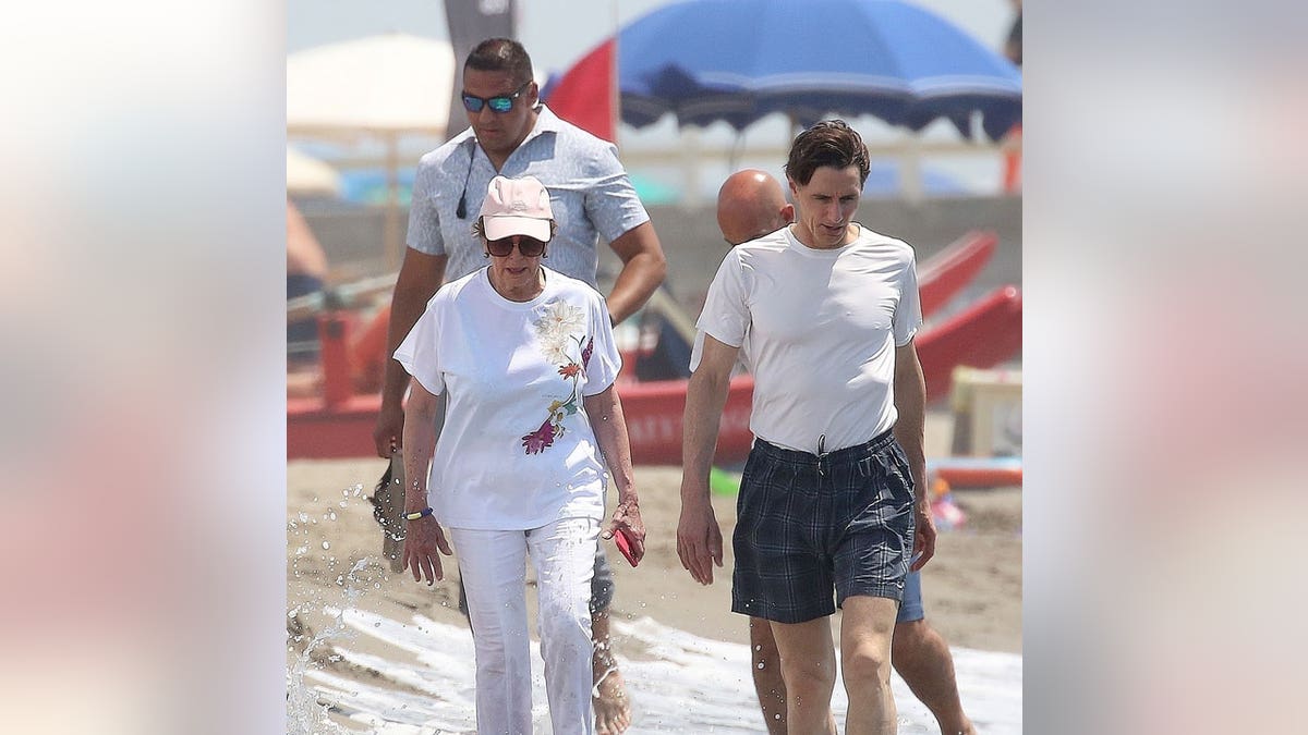 Nancy Pelosi walks on the beach in Italy