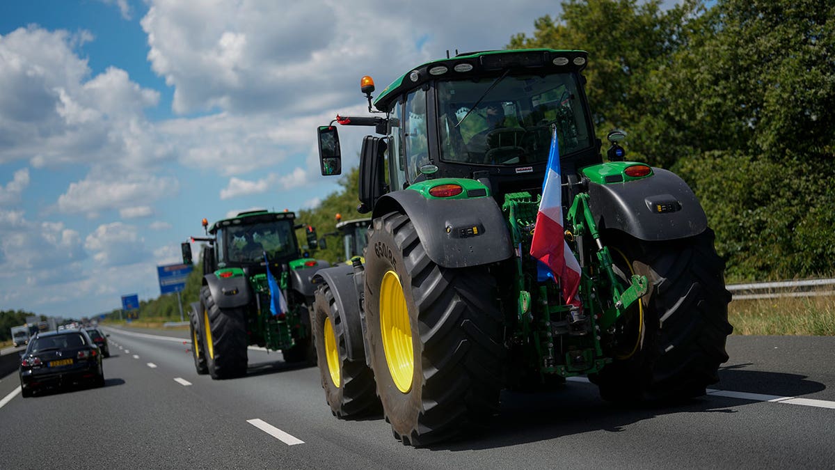 Dutch farmers protest, tractors on the road with cars