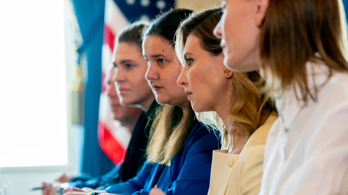 Olena Zelenska sits with Jill Biden