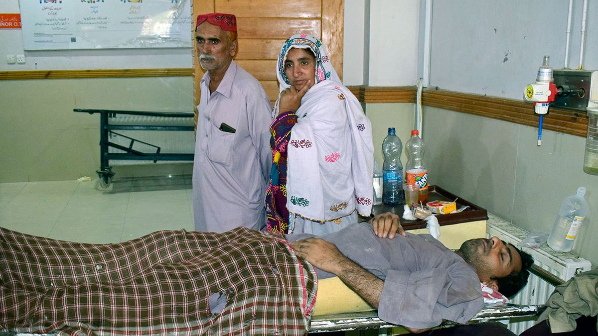 Injured man is treated after Pakstani bus accident