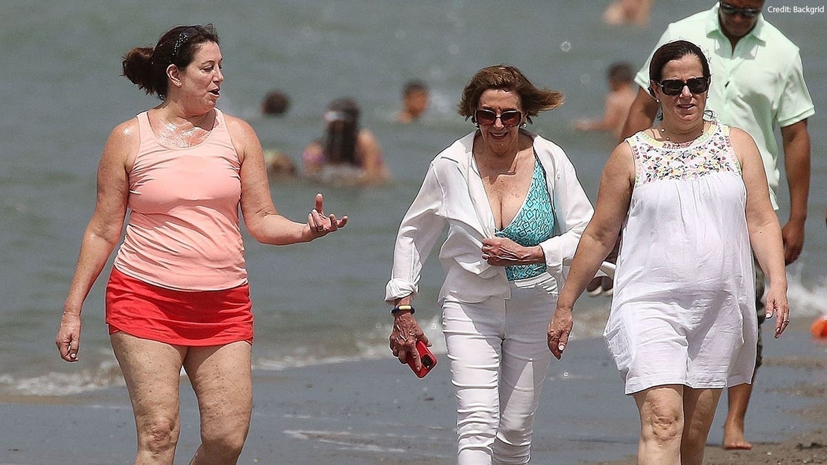 See the pics Pelosi hits Italian beach
