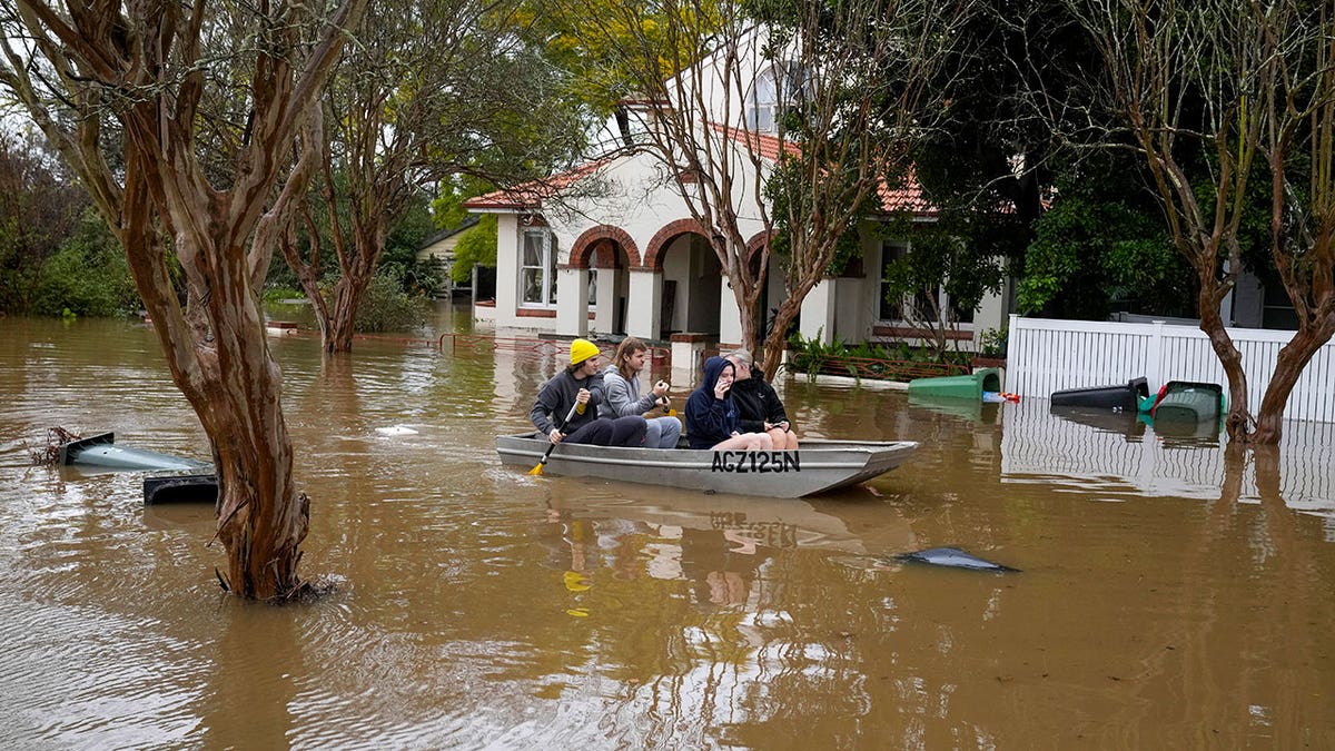 Sydney residents in boat due to floods