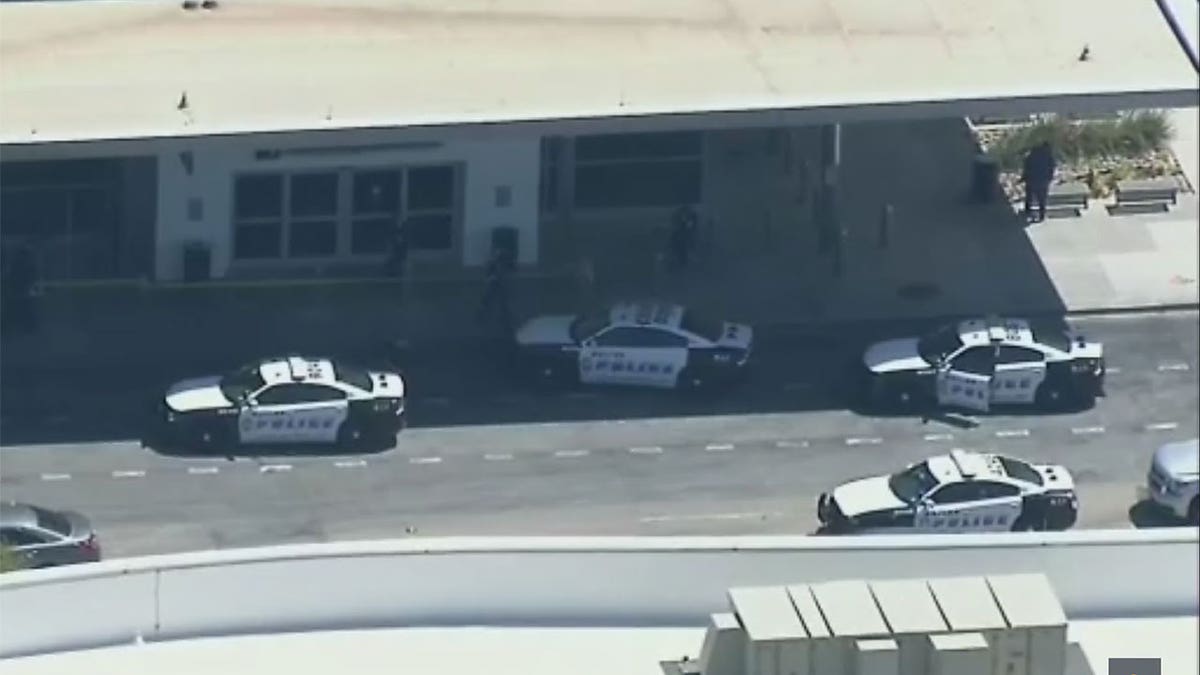 Police cars parked outside of Dallas Love Field Airport