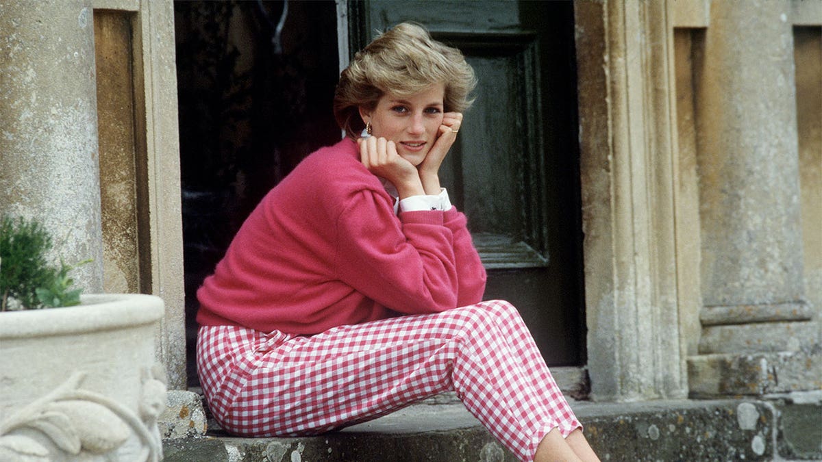 Princess Diana sitting on the steps of Highgrove House