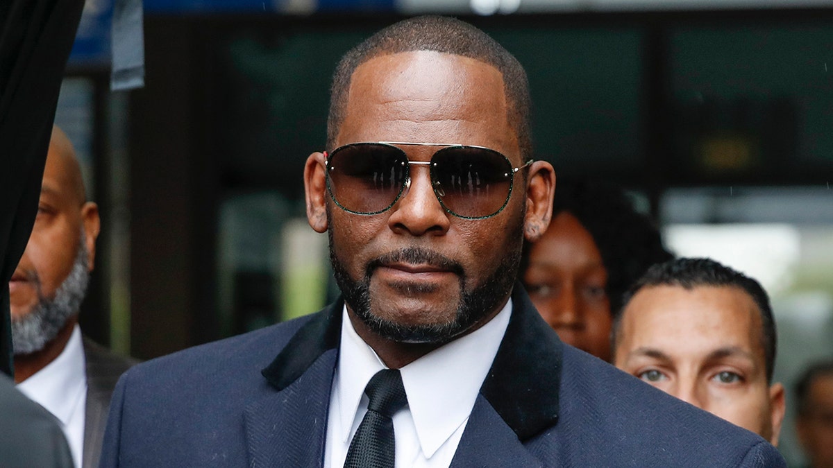 R. Kelly with sunglasses outside