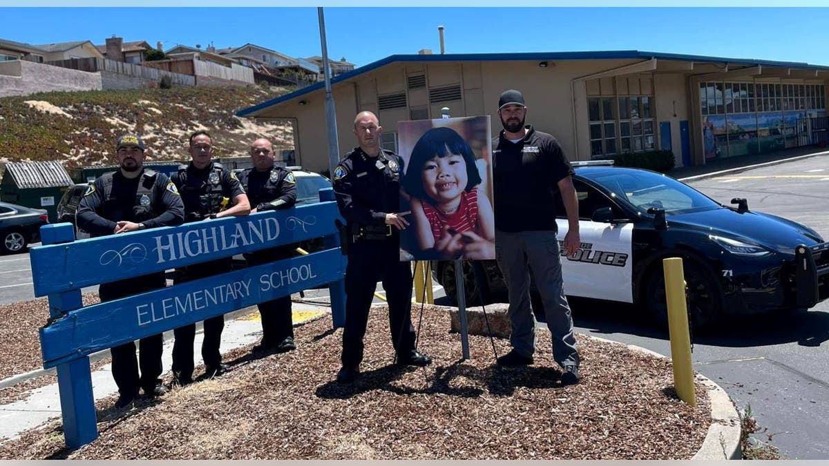 Seaside police officers with photo of Anne Pham