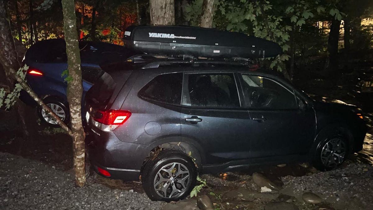 Flash floods in Tennessee swept cars away and forced people from their homes