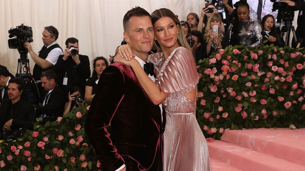 Tom Brady and Gisele Bündchen hugging at the 2019 Met Gala