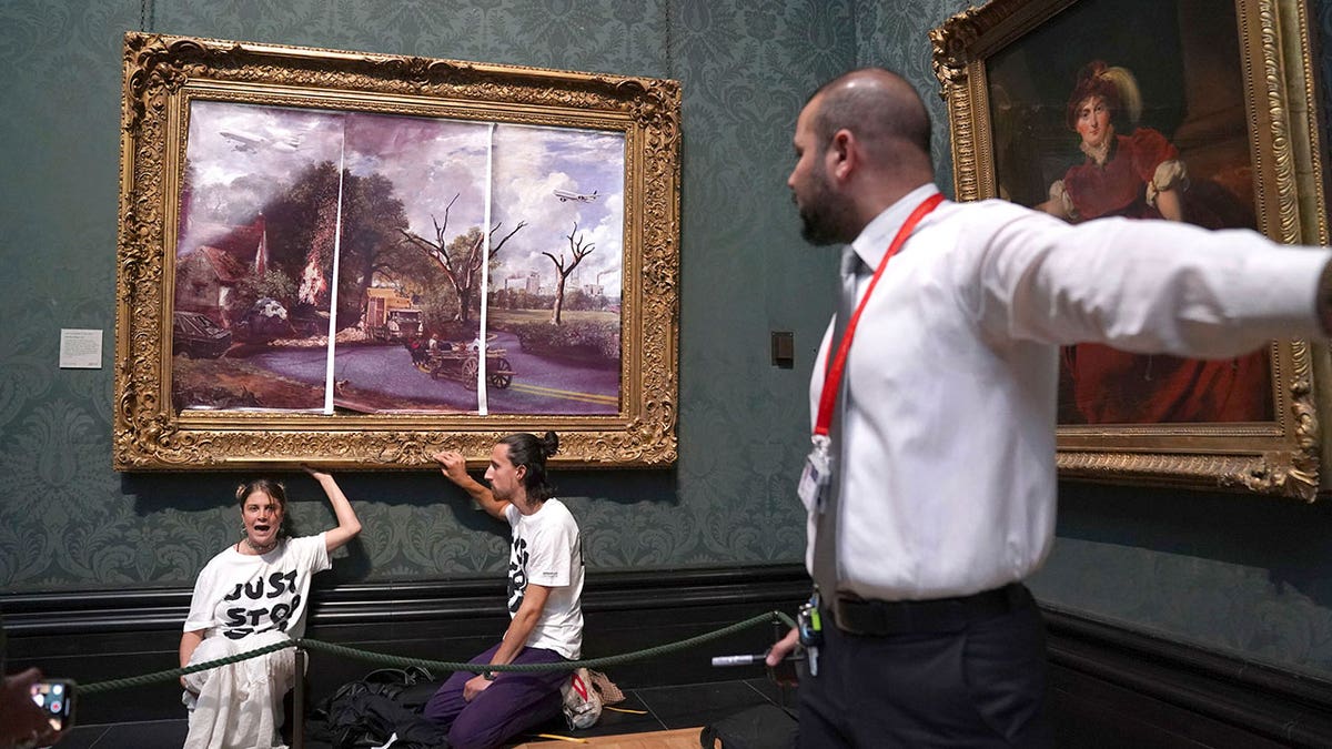 Security guard with UK climate protestors