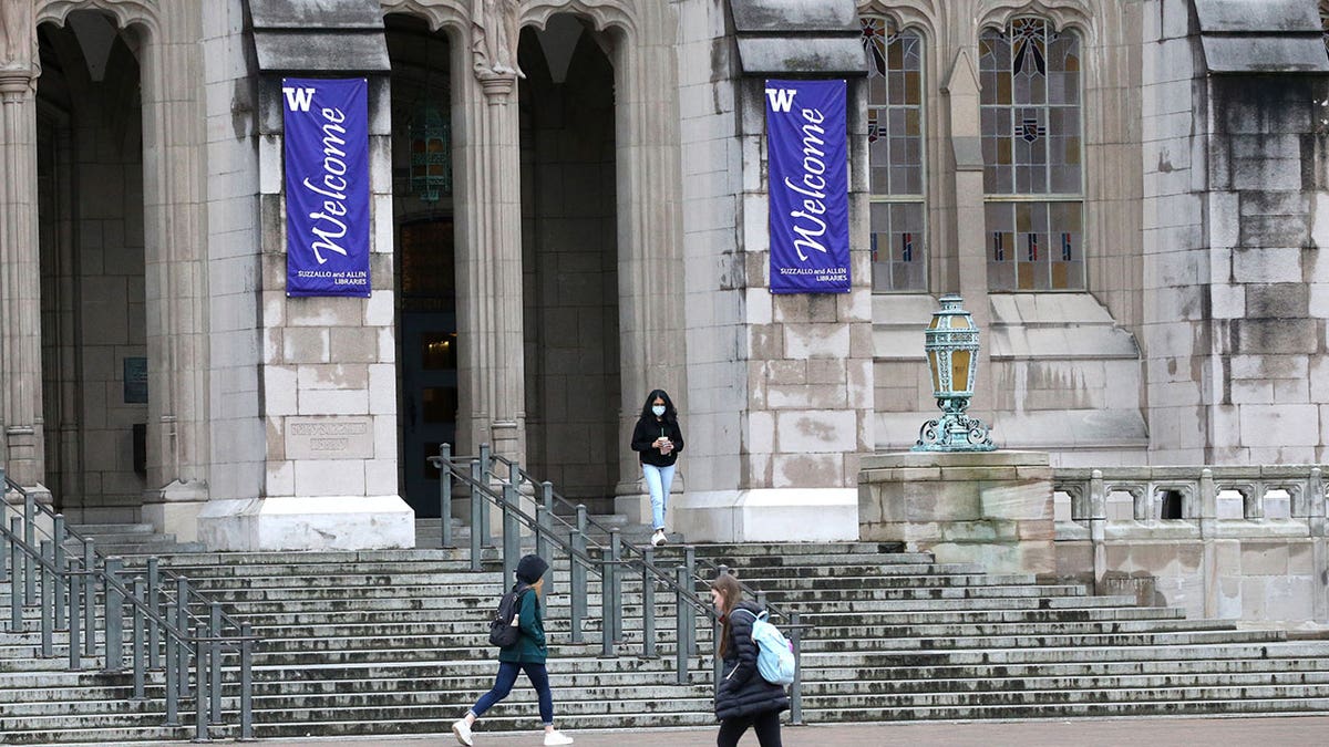 University of Washington building with stairs and blue "welcome" banners