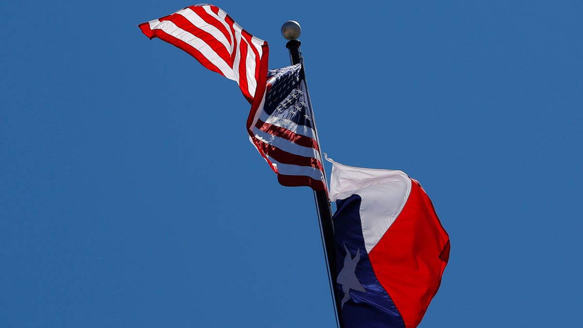 Flags for Texas and America fly together