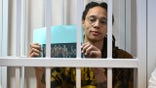 US WNBA basketball superstar Brittney Griner sits inside a defendants' cage during a hearing at the Khimki Court in the town of Khimki outside Moscow on July 15, 2022. - Griner, a two-time Olympic gold medallist and WNBA champion, was detained at Moscow airport in February on charges of carrying in her luggage vape cartridges with cannabis oil, which could carry a 10-year prison sentence.