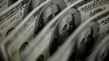 A picture illustration shows U.S. 100 dollar bank notes taken in Tokyo August 2, 2011. REUTERS/Yuriko Nakao/File Photo/File Photo