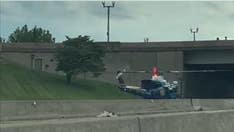 US Park Police helicopter lands on DC freeway to rescue motorcycle officer after accident