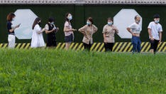 Beijing residents asked to wear monitoring bracelets to enforce COVID quarantine, prompting outcry