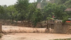 China floods leave at least 12 dead, thousands evacuated