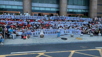 Chinese bank depositors face police in angry protest